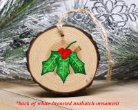 Hand-painted holly leaves and red berries on the back of a handmade ornament at covecreekphotography.com.