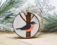 A hand-painted American robin in the snow wood slice Christmas ornament at Cove Creek Photography.