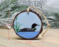 An image of a common loon acrylic painting on a wood slice Christmas ornament at Cove Creek Photography with measurements.