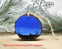 An acrylic painting of a starry night with a silhouette of a duck on water in a marsh available at Cove Creek Photography.