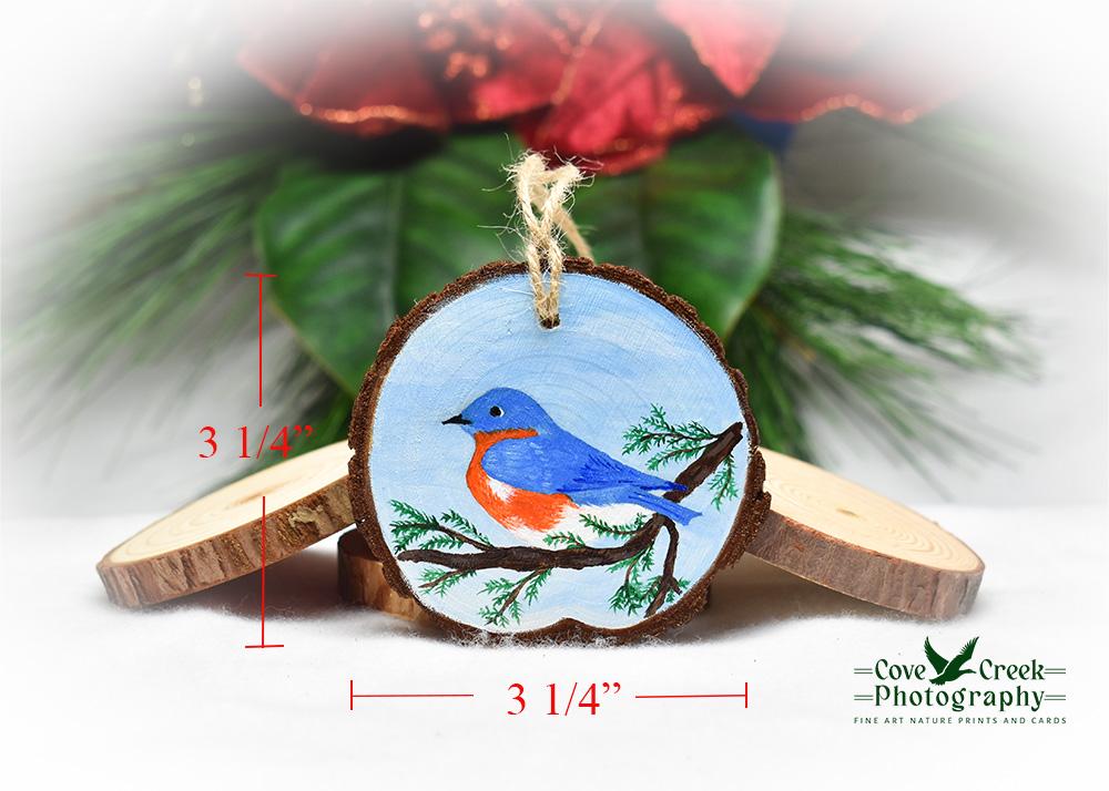 A hand-painted wood slice with ornament dimensions.