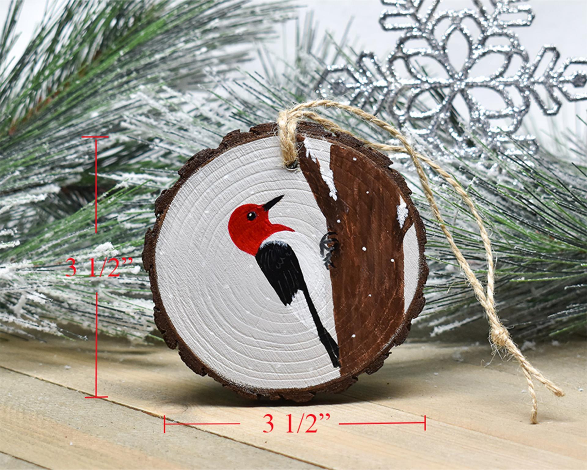 A handmade red-headed woodpecker Christmas ornament with a diagram of ornament measurements at Cove Creek Photography.