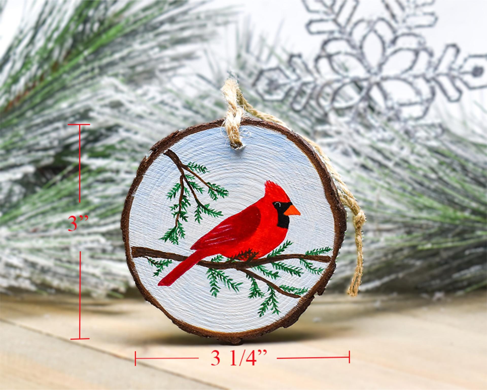 A handmade wood slice ornament with measurements displayed along the ornament at covecreekphotography.com.