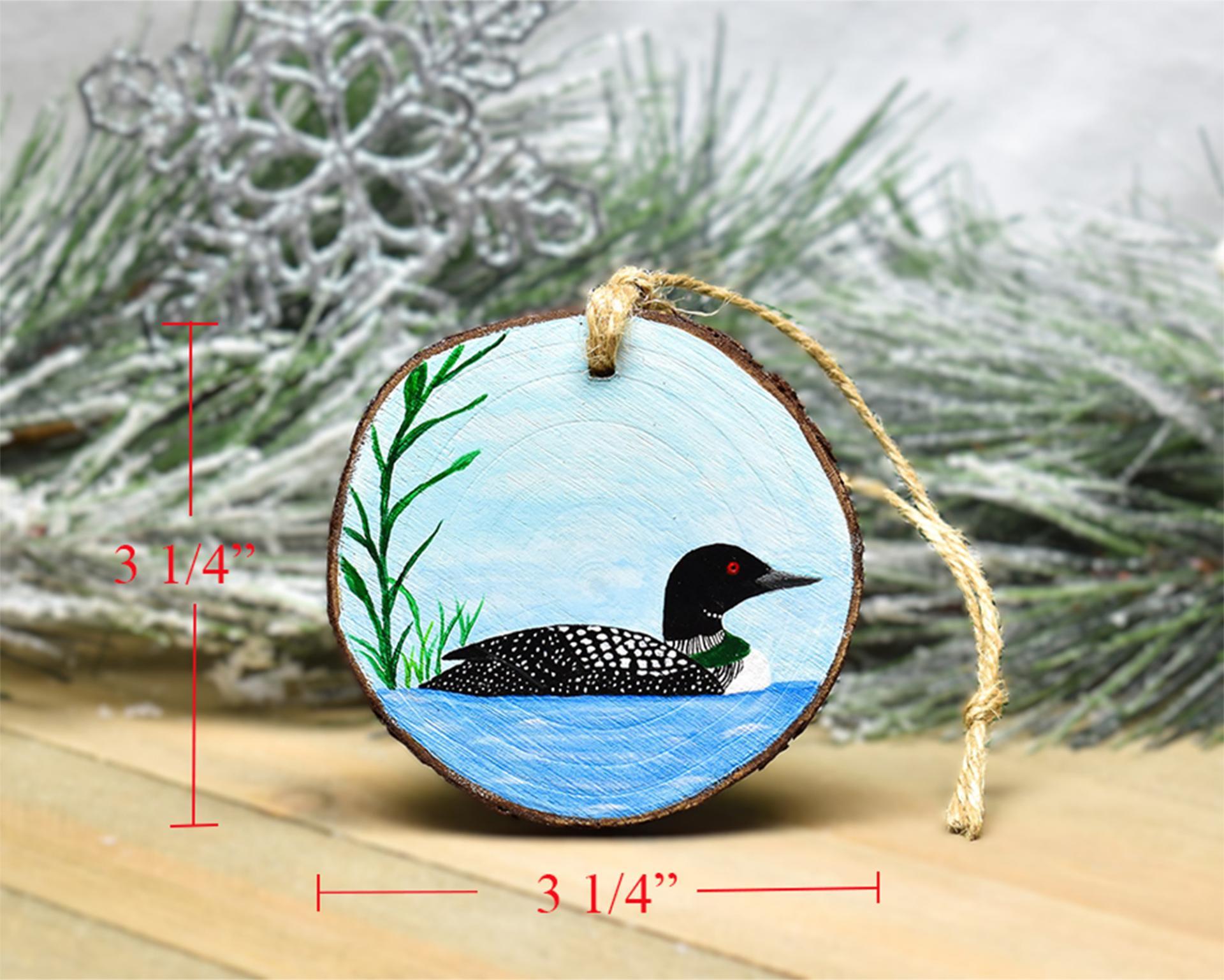 Measurements are displayed on an image of a hand-painted common loon wood slice Christmas ornament at covecreekphotography.com.