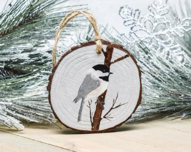A hand-painted chickadee wood slice ornament available at Cove Creek Photography.